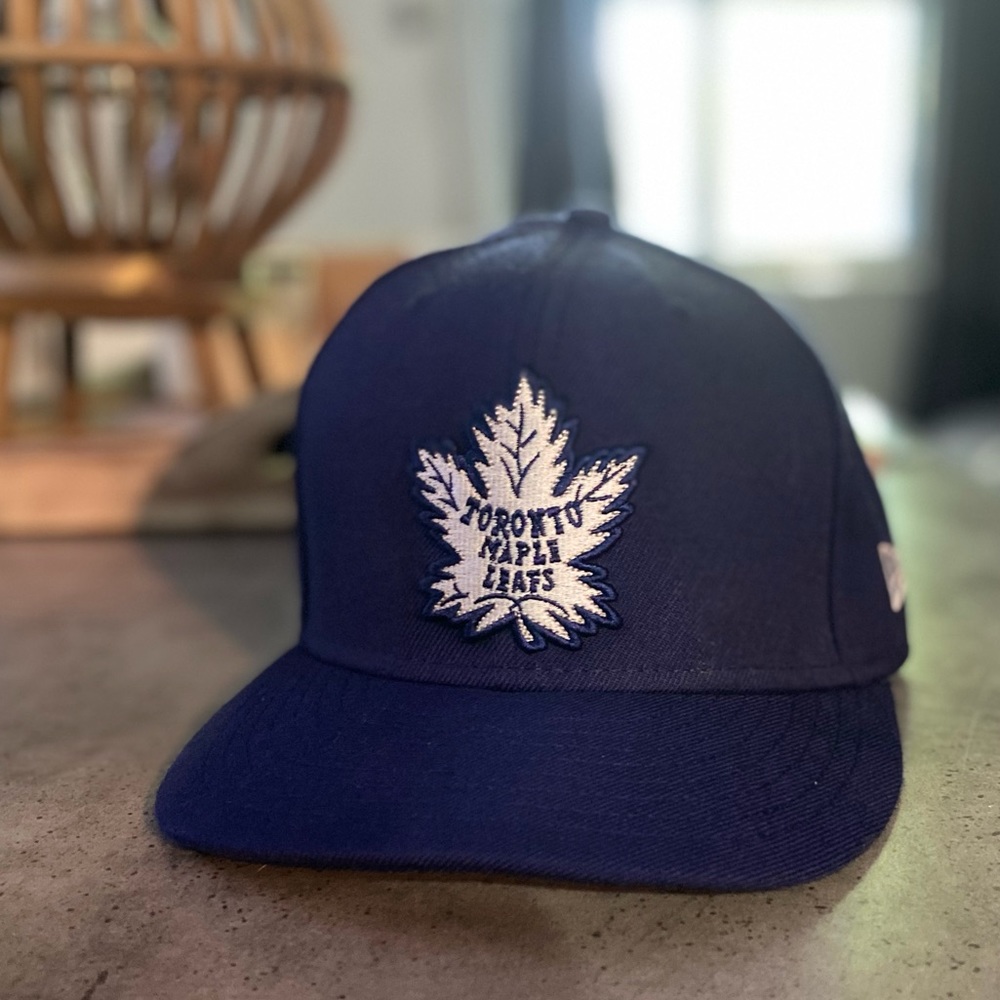 New Era fitted. 7 1/8. Toronto Maple Leafs.